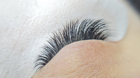close up of eyelash extensions in beauty salon macro eye.の写真素材