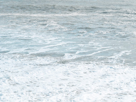blue sea with waves and sandy shore ,beautiful natural seascape,wallpaper and background copy space