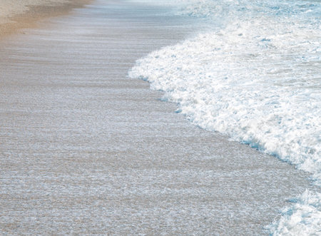 blue sea with waves and sandy shore ,beautiful natural seascape,wallpaper and background copy spaceの写真素材