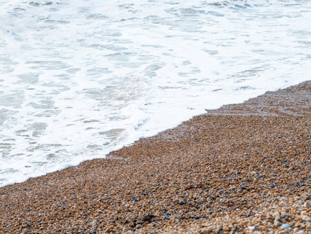 blue sea with waves and sandy shore ,beautiful natural seascape,wallpaper and background copy spaceの写真素材