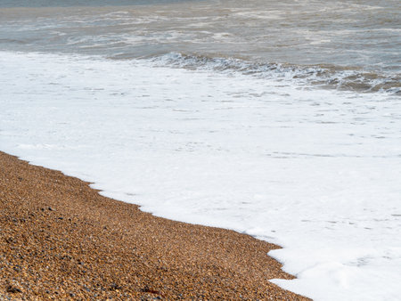 blue sea with waves and sandy shore ,beautiful natural seascape,wallpaper and background copy spaceの写真素材