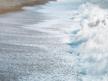 blue sea with waves and sandy shore ,beautiful natural seascape,wallpaper and background copy spaceの写真素材