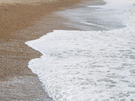 blue sea with waves and sandy shore ,beautiful natural seascape,wallpaper and background copy spaceの写真素材