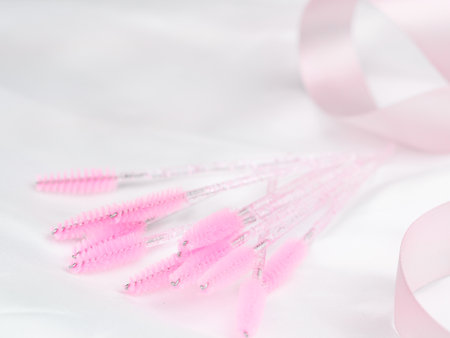 close up of pink brushes for combing eyelash extensions and brows,tool for treatment in beauty salon.の写真素材