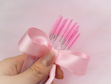 close up of pink brushes for combing eyelash extensions and brows,tool for treatment in beauty salon.の写真素材