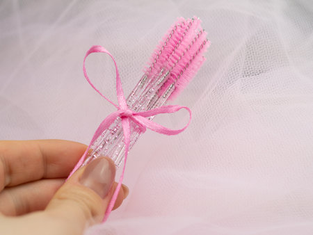 close up of pink brushes for combing eyelash extensions and brows,tool for treatment in beauty salon.の写真素材