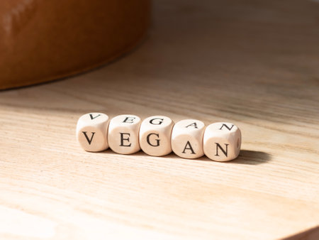 close up of inscription vegan on wooden background ,healthy eating concept. High quality photoの写真素材
