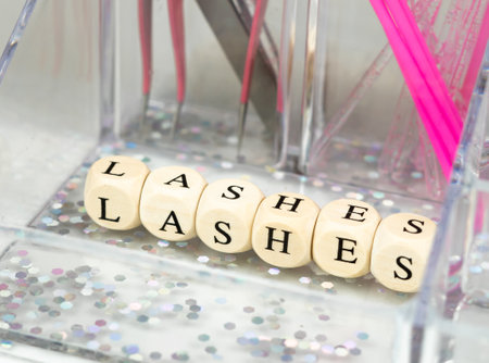 inscriptions lashes on wooden beads,beauty salon treatment concept.lash extensionsの写真素材