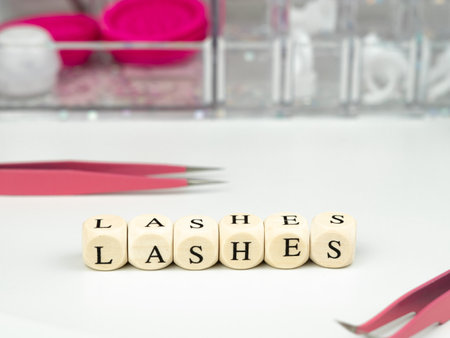 inscriptions lashes on wooden beads,beauty salon treatment concept.lash extensionsの写真素材