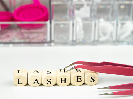 inscriptions lashes on wooden beads,beauty salon treatment concept.lash extensionsの写真素材
