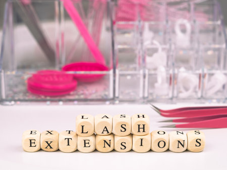 inscriptions lashes on wooden beads,beauty salon treatment concept.lash extensionsの写真素材