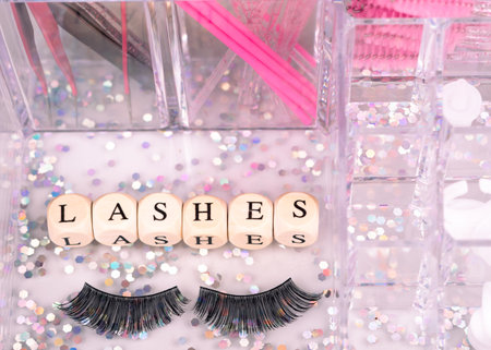 inscriptions lashes on wooden beads,beauty salon treatment concept.lash extensionsの写真素材