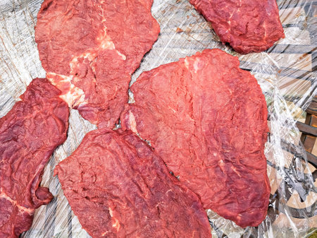cutted fresh meat on the grill for barbecue on countryside cottage ,steak. High quality photoの写真素材
