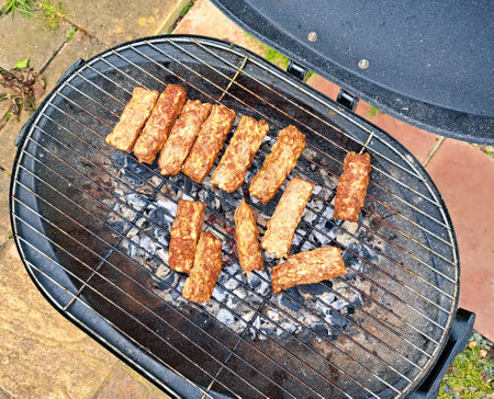 cutted fresh meat on the grill for barbecue on countryside cottage ,steak. High quality photoの写真素材