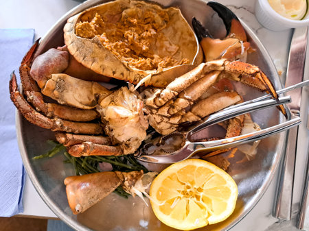 Boiled crab and seashells in plate,seafood on the table in restaurant,. High quality photo