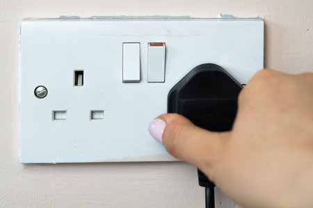 close up of english socket in the wall, electricity billsの写真素材