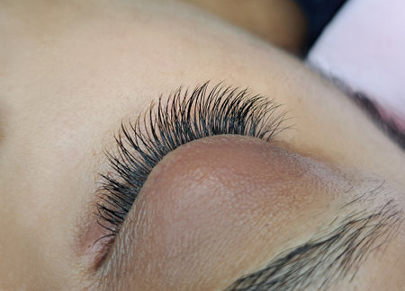 close up of eyelash extensions in beauty salon macro eye. 2d,3d,russian volume,kim classical volumeの写真素材