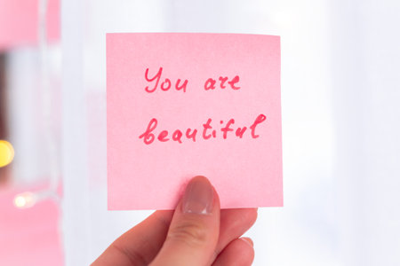 inspirational quotes on pink sticker on the mirror,handwriting text.の写真素材