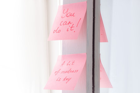 inspirational quotes on pink sticker on the mirror,handwriting text.