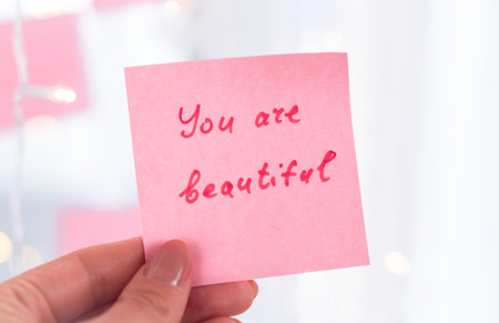 inspirational quotes on pink sticker on the mirror,handwriting text.の写真素材