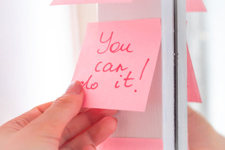 inspirational quotes on pink sticker on the mirror,handwriting text.の写真素材