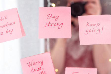 inspirational quotes on pink sticker on the mirror,handwriting text.の写真素材