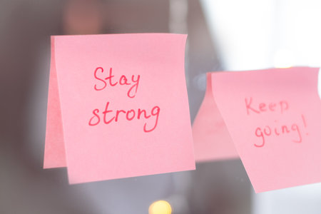 inspirational quotes on pink sticker on the mirror,handwriting text.の写真素材
