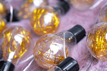 garland with golden lamps, home decor.の写真素材