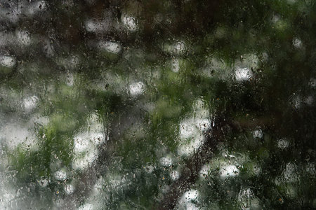 drops of rain on the window,wet weather,backgroundの写真素材