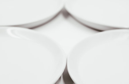 White round plate on white background copy space . High quality photoの写真素材