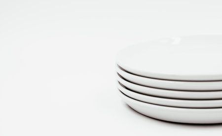 White round plate on white background copy space . High quality photoの写真素材