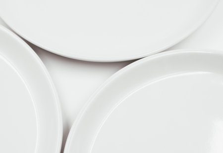 White round plate on white background copy space . High quality photoの写真素材