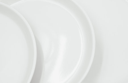 White round plate on white background copy space . High quality photoの写真素材
