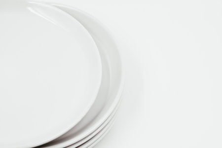 White round plate on white background copy space . High quality photoの写真素材