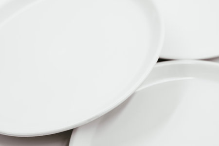 White round plate on white background copy space . High quality photoの写真素材