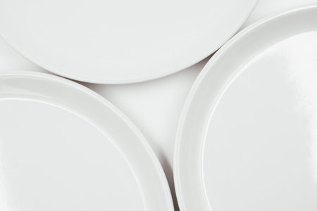 White round plate on white background copy space . High quality photoの写真素材