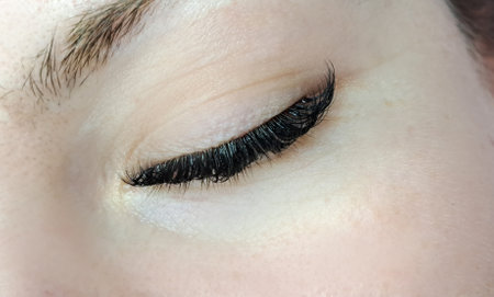 Close up of eye with eyelash extensionsの写真素材