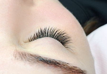 Close up of eye with eyelash extensions ,beauty salon treatment ,2d volume, 3d volume, classical lashes,Russian volume,megavolume, new set.の写真素材