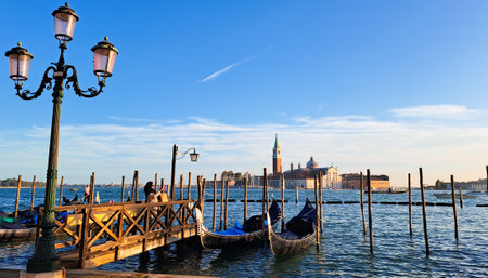Beautiful seascape with gondolas on the blue sea water in Venice. High quality photoの写真素材