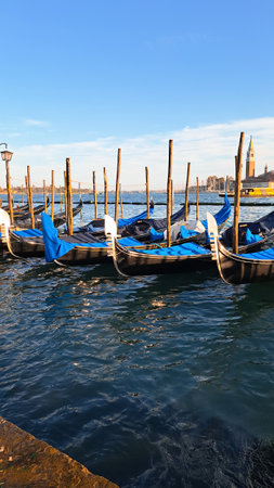 Beautiful seascape with gondolas on the blue sea water in Venice. High quality photoの写真素材