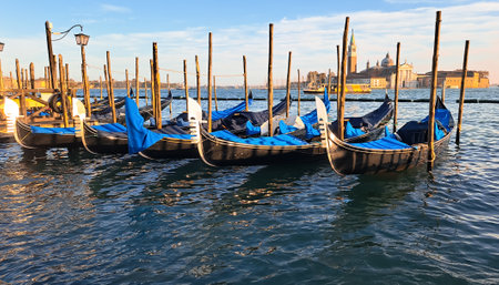Beautiful seascape with gondolas on the blue sea water in Venice. High quality photoの写真素材