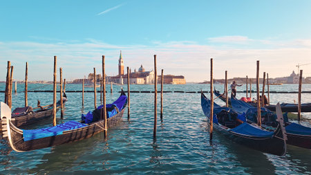 Beautiful seascape with gondolas on the blue sea water in Venice. High quality photoの写真素材