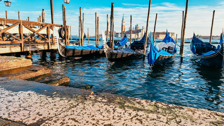 Beautiful seascape with gondolas on the blue sea water in Venice. High quality photoの写真素材