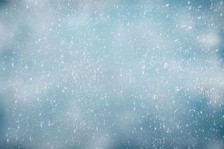 winter background with sparkling snowflakes.の素材