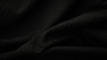 deep black fabric background copy space.