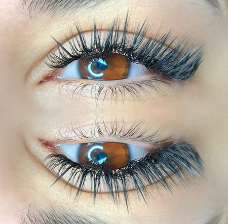 close up of eyelash extensions in beauty salon macro eye.の写真素材