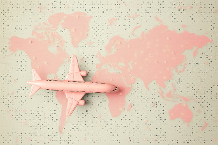 a pink world map with an airplane on it, in the style of pop inspo, soft pink and pink.の素材