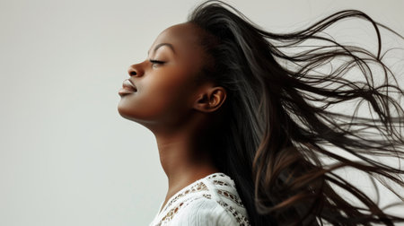 woman with beautiful long hair on white background.の素材