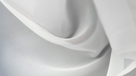 Smooth white fabric background, minimalist elegance for product presentation or design projectsの写真素材