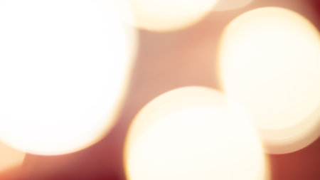 Golden and red bokeh lights create a soft, dreamy background, perfect for a warm, festive atmosphereの写真素材